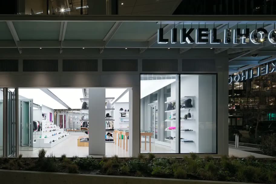 The lit Likelihood storefront in Seattle after dark