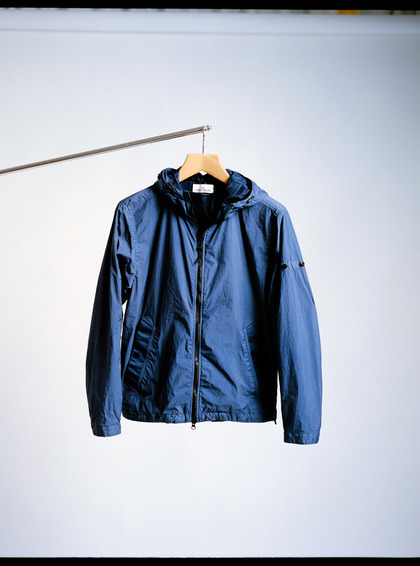 Analog photograph of a jacket on a hanger